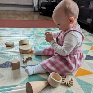 Little Ones: baby playing with bespoke children's box