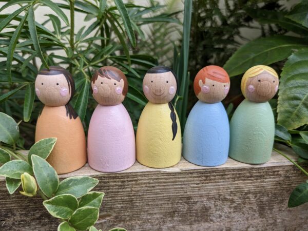 Little ones: pastel coloured peg dolls